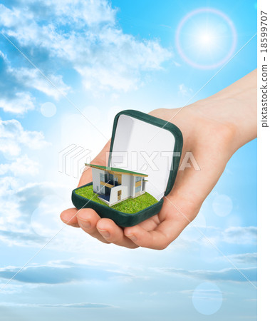 Empty ring box with house in hand Empty ring box with house in hand 18599707