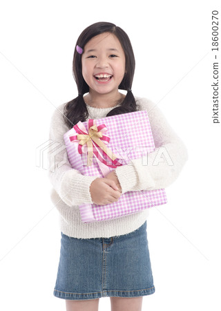 Cute asian girl giving a present Cute asian girl giving a present 18600270
