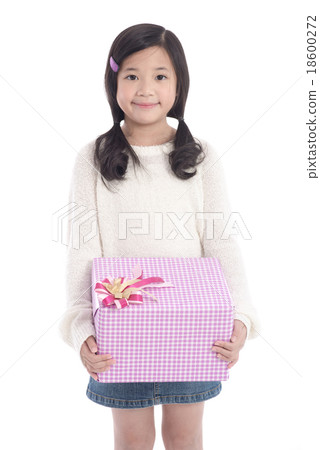 Cute asian girl giving a present Cute asian girl giving a present 18600272