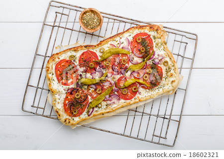 Spicy tarte flambee with pepperoni and olives 18602321