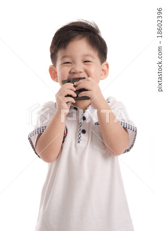 Cute asian child eating rice ball or onigiri Cute asian child eating rice ball or onigiri 18602396