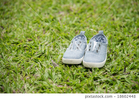 Children's shoes in the grass 18602448