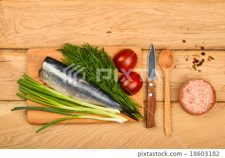 Herring double fillet with vegetables on wood Herring double fillet with vegetables on wood 18603182
