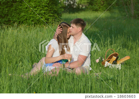 Young couple at a picnic in a city park Young couple at a picnic in a city park 18603603