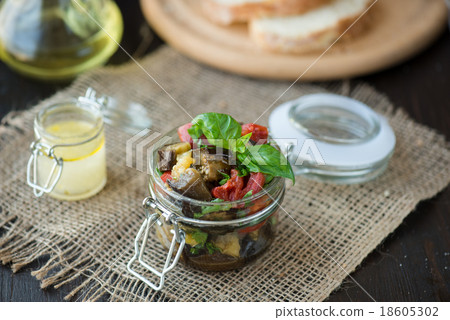 Baked eggplant with tomatoes, garlic and paprika Baked eggplant with tomatoes, garlic and paprika 18605302
