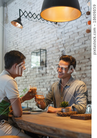 Two Men Cheers Toast Drink Ice Coffee, Asian Mix Two Men Cheers Toast Drink Ice Coffee, Asian Mix 18609859