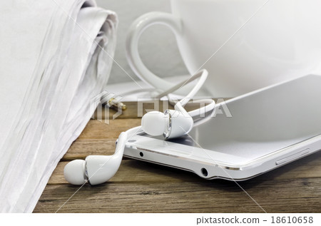 smartphone and newspaper smartphone and newspaper 18610658