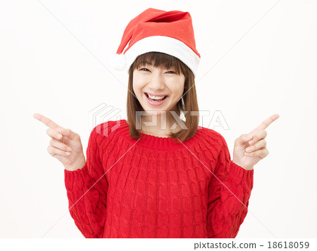 Women's finger pointing over Santa hat 18618059