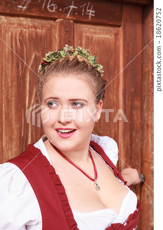 Face portrait of a young woman in dirndl with big Face portrait of a young woman in dirndl with big 18620752