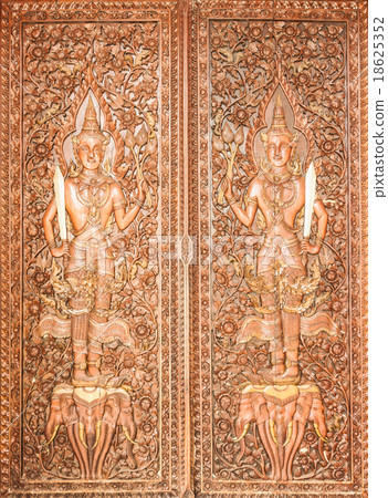 Thai Style Carving on the Temple Door Thai Style Carving on the Temple Door 18625352