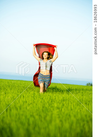 Young happy woman in wheat field with fabric Young happy woman in wheat field with fabric 18626993