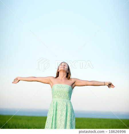 Happiness woman stay outdoor under sunlight of Happiness woman stay outdoor under sunlight of 18626996