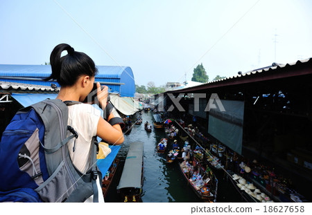 woman tourist taking photo at Damonen Saduak woman tourist taking photo at Damonen Saduak 18627658