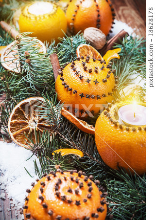 dried oranges with nuts and burning candles 18628178