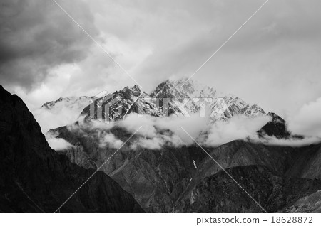 mountain peaks through the clouds mountain peaks through the clouds 18628872