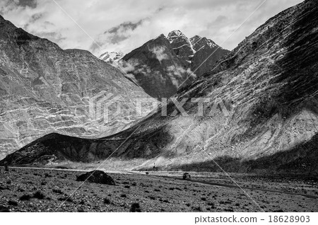 mountain peaks through the clouds mountain peaks through the clouds 18628903