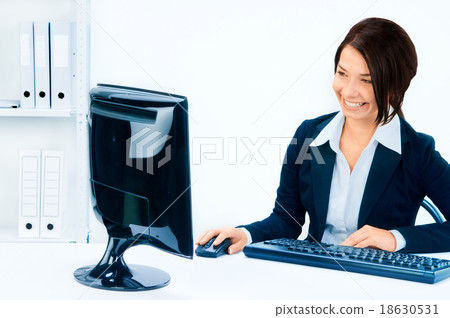 Business woman in an office environment Business woman in an office environment 18630531