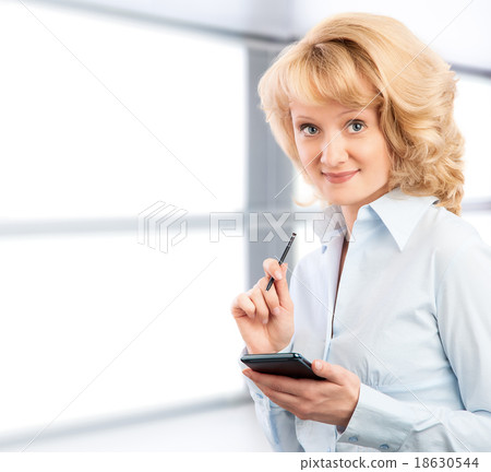 Business woman using her smartphone Business woman using her smartphone 18630544