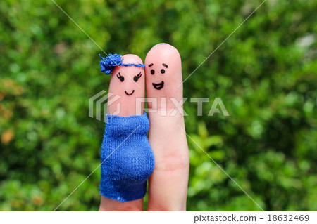 Face painted on fingers. Happy couple, the woman i 18632469