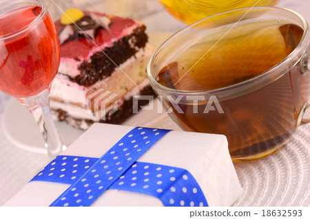 glass cup of tea, gift box and chocolate cake glass cup of tea, gift box and chocolate cake 18632593