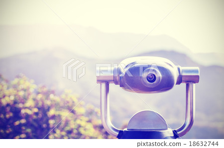 Vintage toned monocular pointed at horizon. Vintage toned monocular pointed at horizon. 18632744