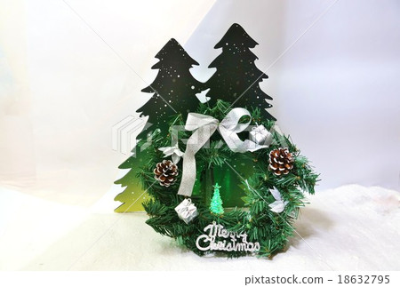 Christmas image · tree of green light in the snow forest and green Christmas lease · horizontal position 18632795