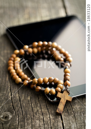 wooden rosary beads with computer tablet 18633120