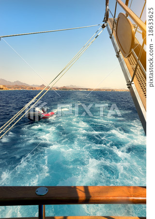 Sailboat near coastline 18633625
