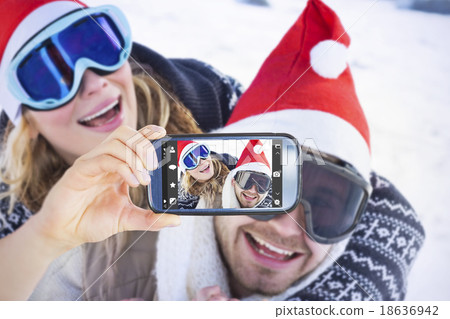 Composite image of hand holding smartphone showing 18636942
