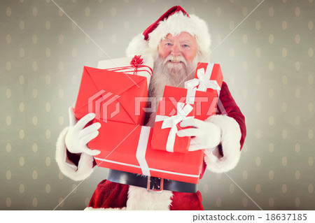 Composite image of santa carries a few presents Composite image of santa carries a few presents 18637185