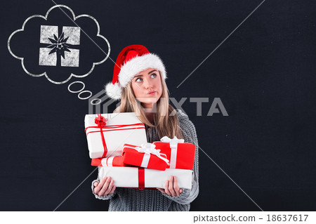 Composite image of festive blonde holding pile of gifts 18637617