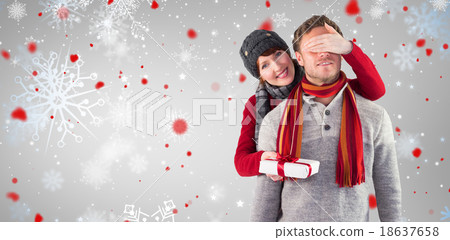 Composite image of woman giving man a present Composite image of woman giving man a present 18637658