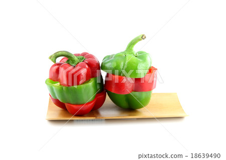 Slice the Three color of bell pepper in the Bamboo dish. 18639490