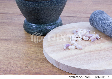 garlic on wood block garlic on wood block 18640504