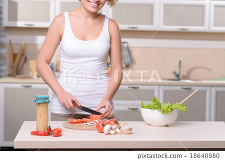 Pleasant woman cooking Pleasant woman cooking 18640980