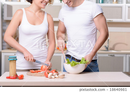 Nice couple cooking in the kitchen Nice couple cooking in the kitchen 18640981
