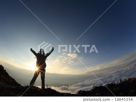 backpacker hiking on sunset mountain peak backpacker hiking on sunset mountain peak 18645354