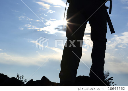 backpacker hiking on sunset mountain peak backpacker hiking on sunset mountain peak 18645362
