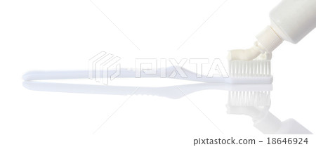 Toothpaste being squeezed onto toothbrush 18646924