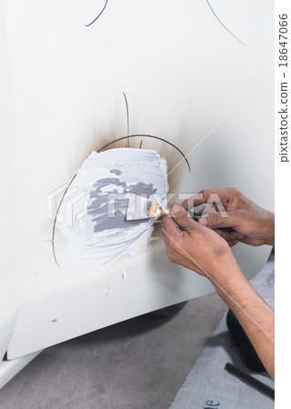 Car paint repair series : Worker repairs white car Car paint repair series : Worker repairs white car 18647066