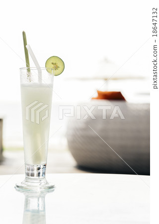 Glass of smoothie lemonade on glass table Glass of smoothie lemonade on glass table 18647132