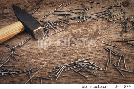 metal Hammer and nails on wooden board metal Hammer and nails on wooden board 18651829