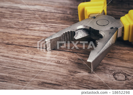 multitool pliers on wooden background 18652298