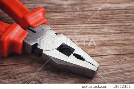 multitool pliers on wooden background 18652301
