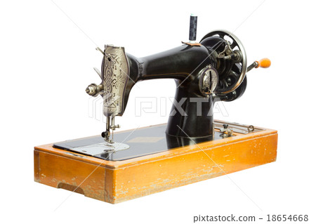 Old black sewing machine isolated ob white Old black sewing machine isolated ob white 18654668