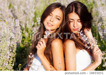 图库照片: two girls on the meadow