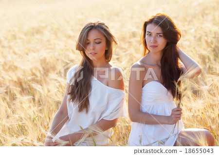 Two beautiful woman on the corn field Two beautiful woman on the corn field 18655043