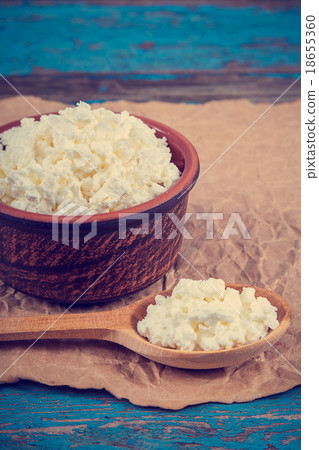 Fresh cottage cheese in a ceramic dish and spoon Fresh cottage cheese in a ceramic dish and spoon 18655360