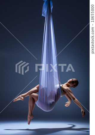 Young beautiful dancer in beige dress posing on Young beautiful dancer in beige dress posing on 18655800