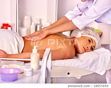 Stock Photo: Woman middle-aged in spa salon with beautician.